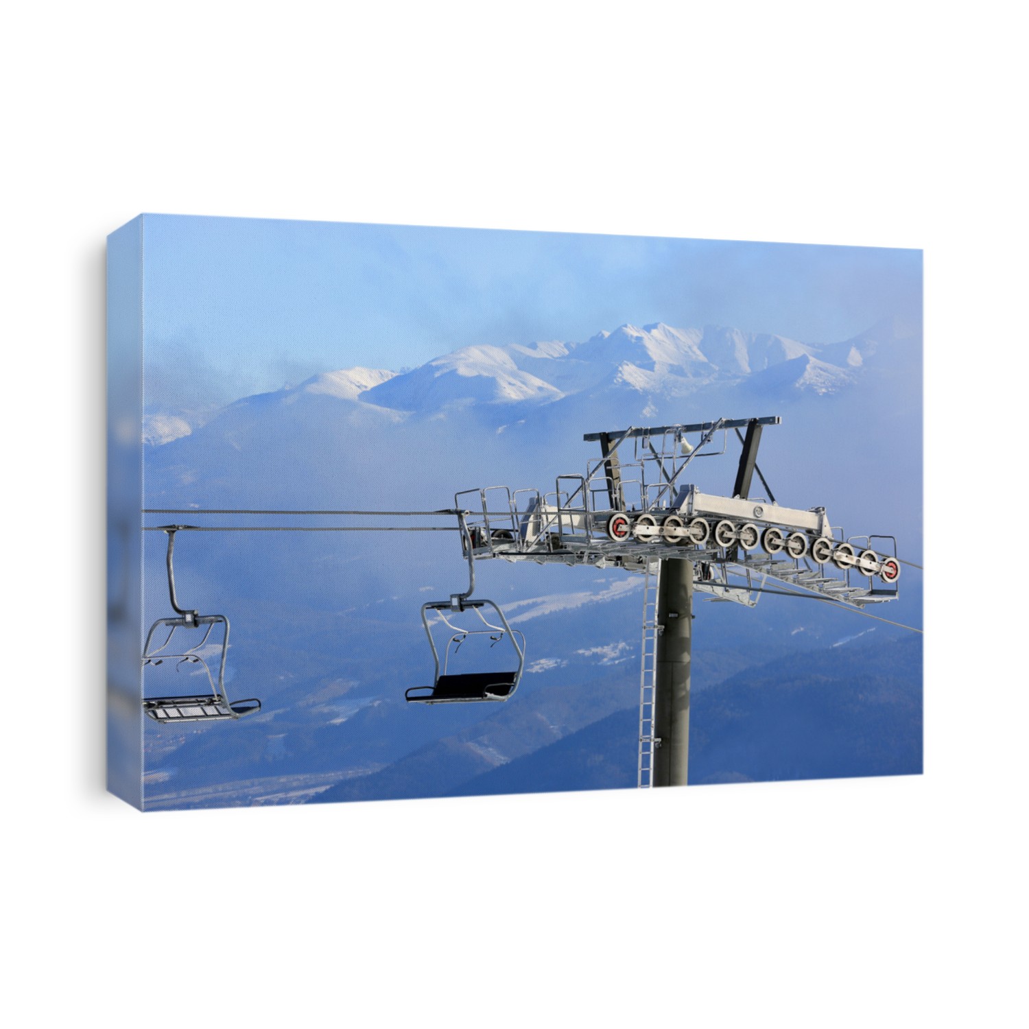 Chairlift on winter ski resort against mountain background